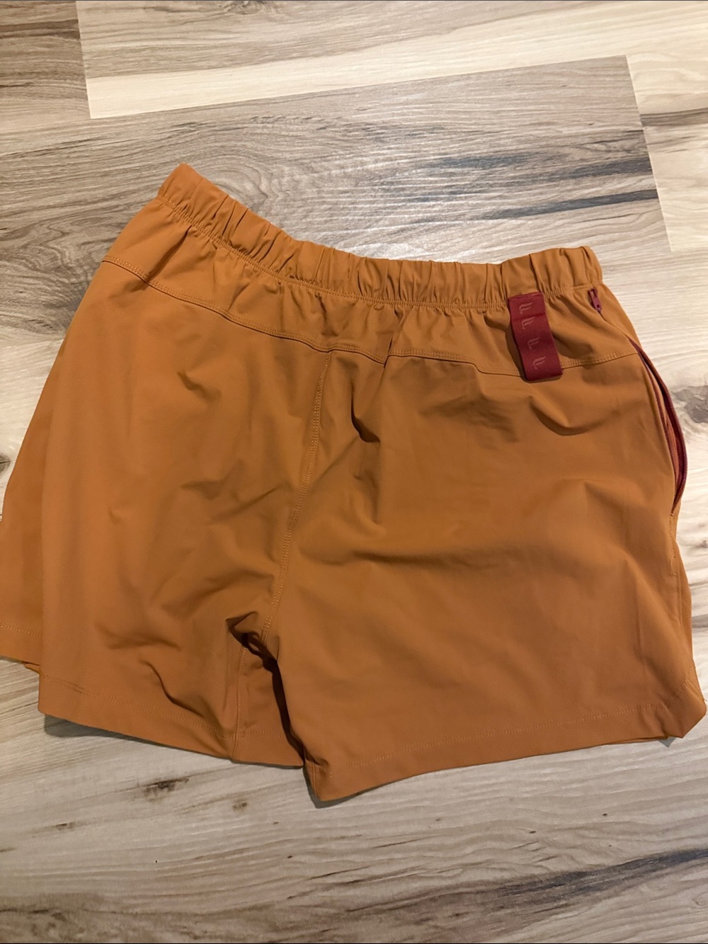 5 inch Fabletics Men's Orange Athletic Shorts with Red Drawstring - Picture 5 of 5
